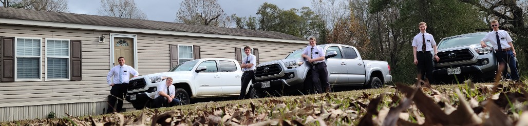 3 companionships w/ their Toyota Tacomas in front of the Fred elders' home